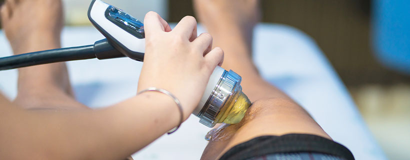 patient receiving shockwave therapy in Addison TX