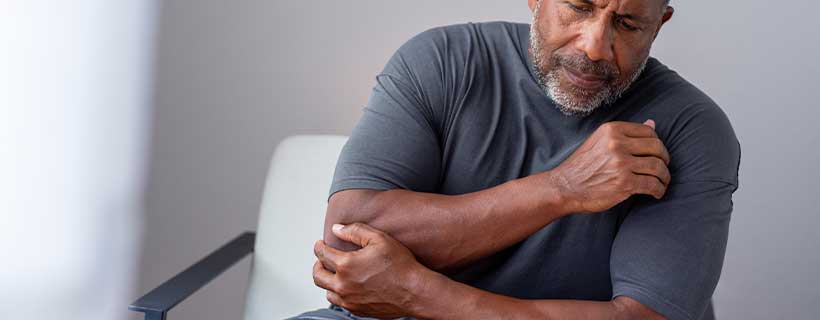 patient needing elbow pain chiropractor in Addison TX