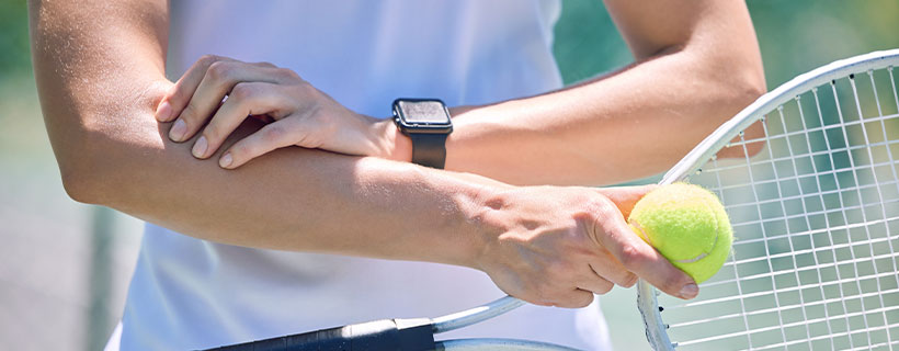 patient needing tennis elbow chiropractor in Addison TX